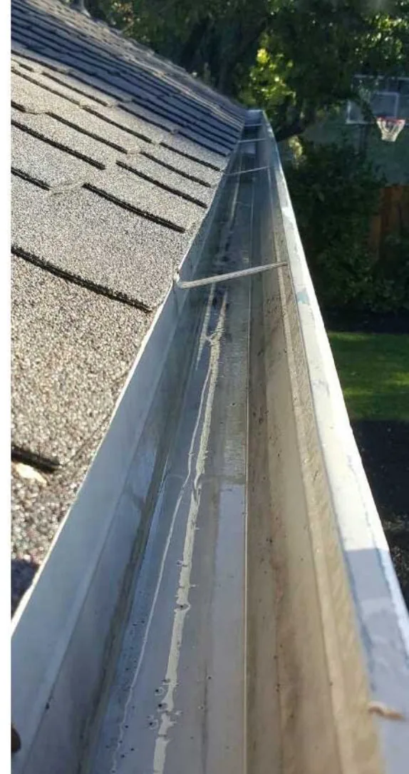 The same gutter clear and draining after a Dunzo Gutters cleaning