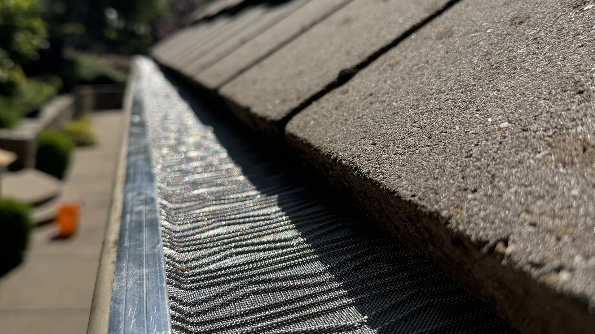 Close-up of a micro-mesh gutter guard installed on a Sacramento home