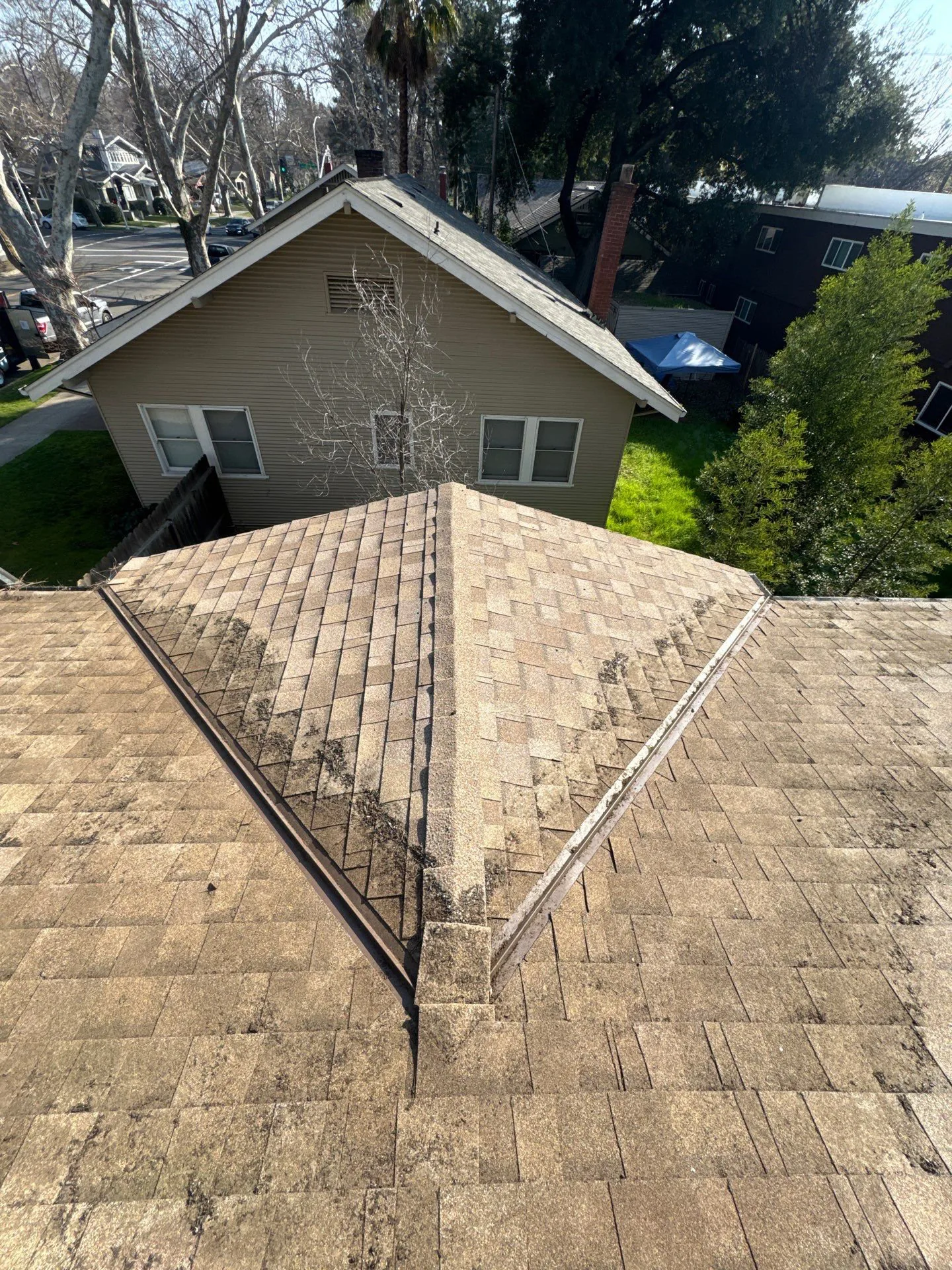 The same Sacramento roof valley cleared of debris after a Dunzo Gutters roof cleaning