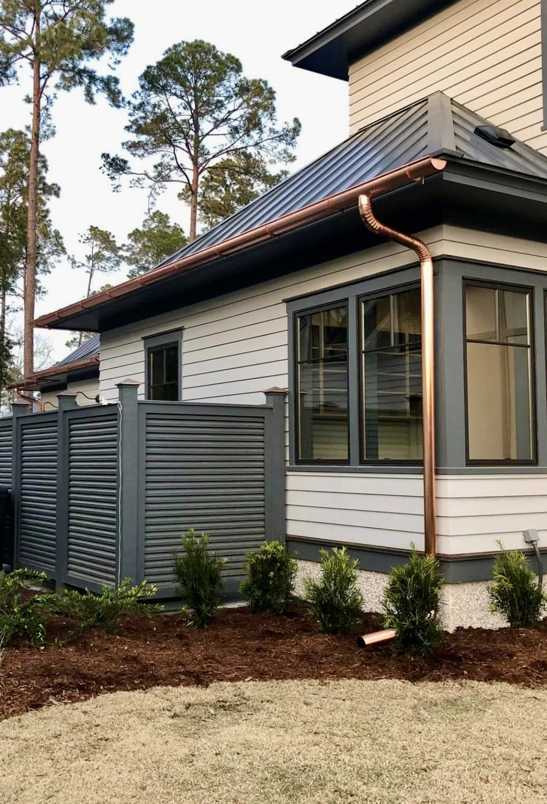 Finished copper seamless gutters and downspout on an upscale home