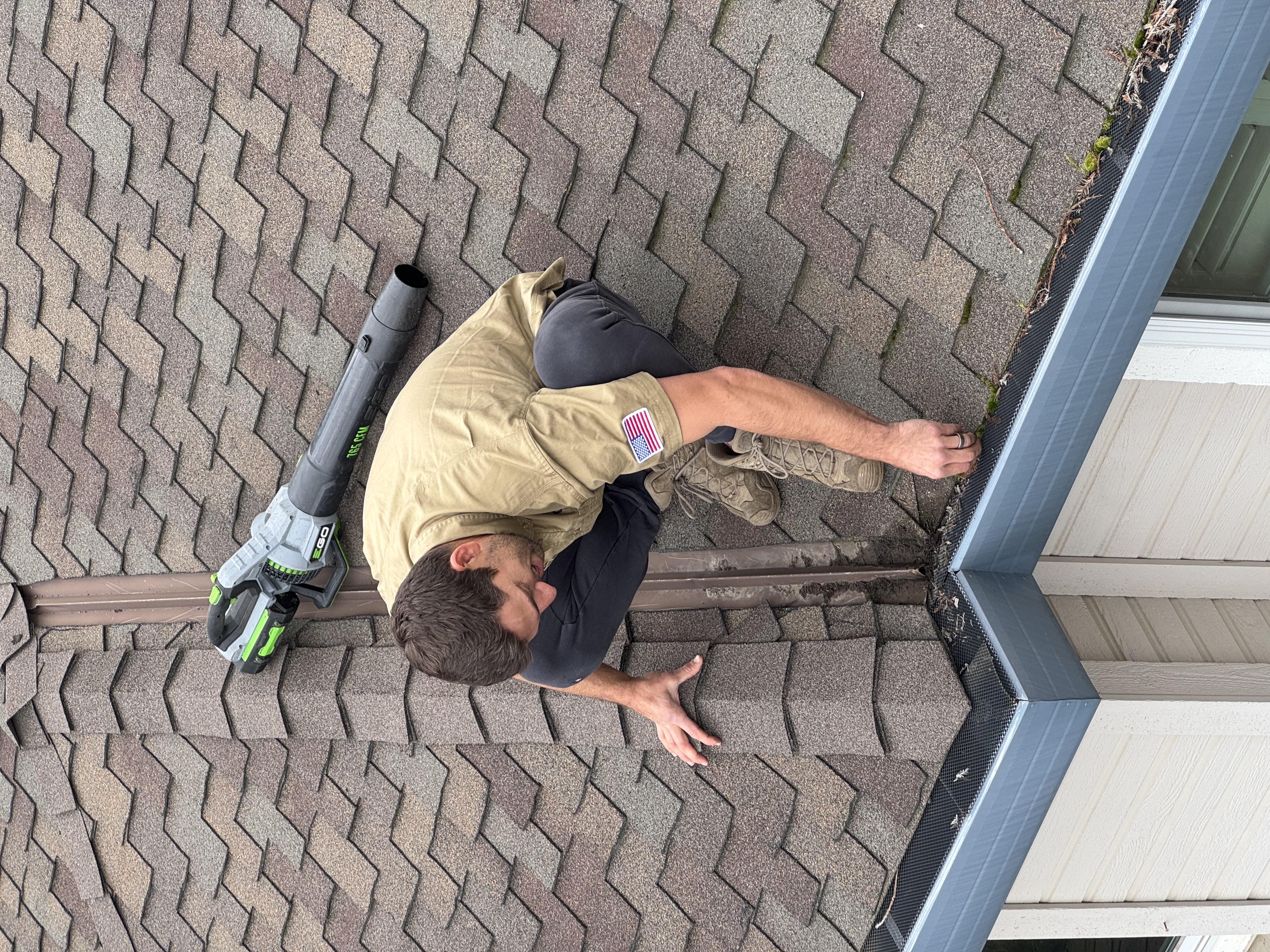 Clark cleaning the gutters