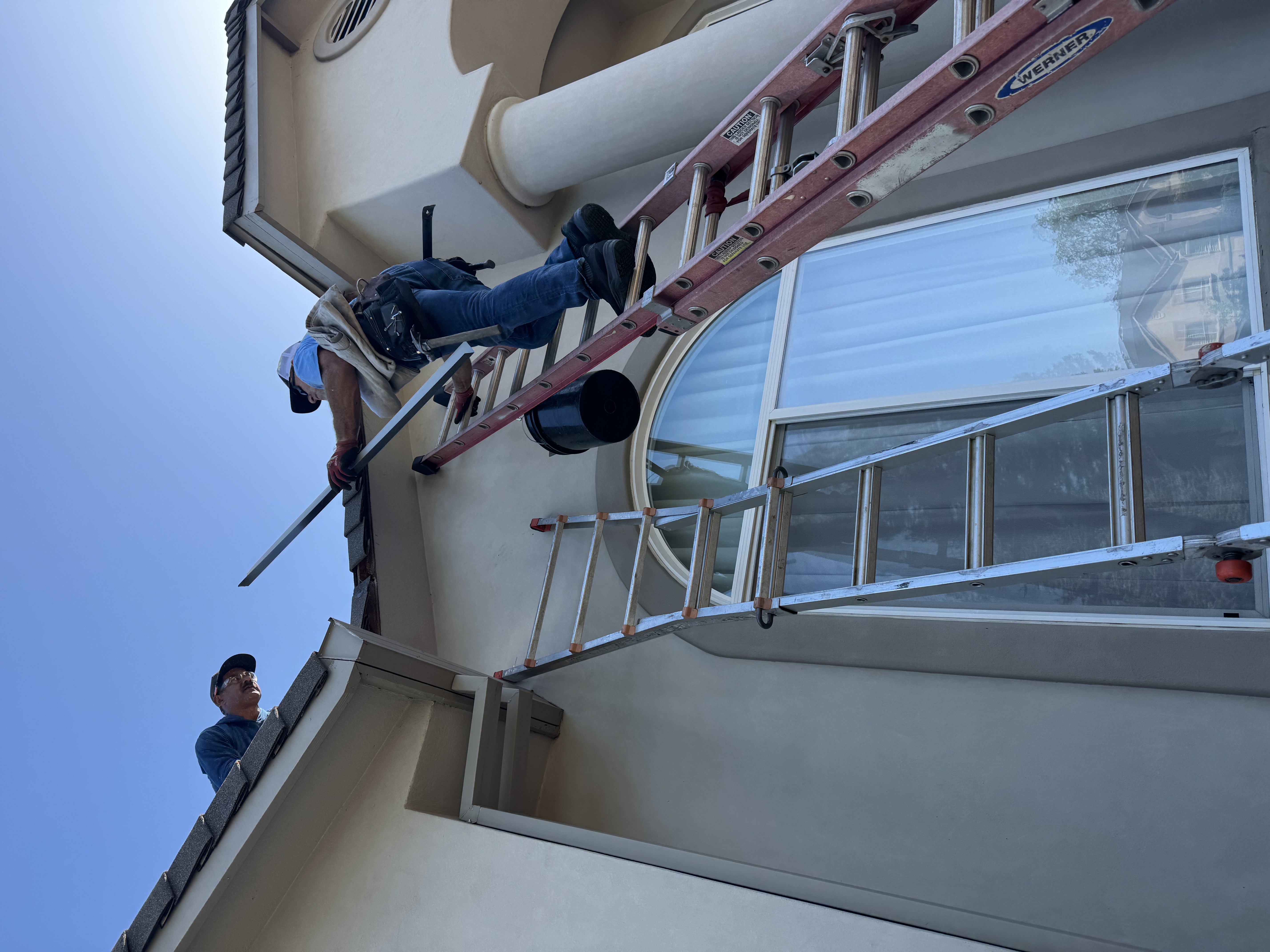 Dunzo Gutter team cleaning gutters and installation